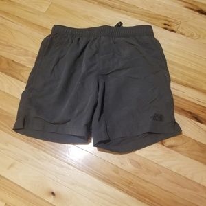 Men's grey North Face swim trunks.